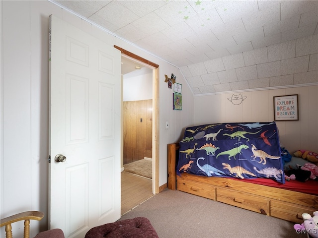 carpeted bedroom featuring vaulted ceiling