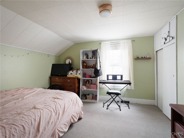 carpeted bedroom featuring lofted ceiling