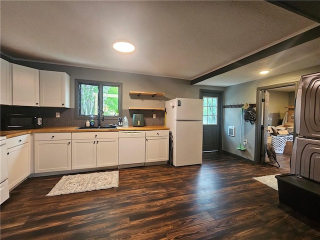 57 Interstate Pkwy, Bradford-City, PA 16701 - kitchen featuring white appliances, a sink, healthy amount of natural light, dark wood-style flooring, and recessed lighting