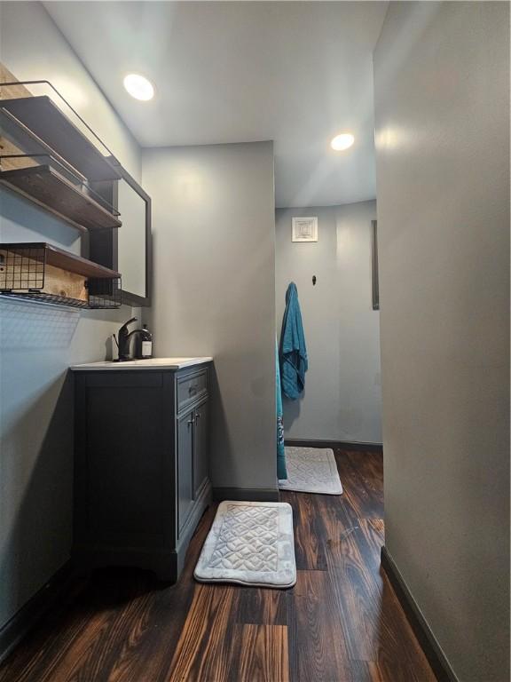57 Interstate Pkwy, Bradford-City, PA 16701 - bathroom featuring wood finished floors, baseboards, vanity, and recessed lighting