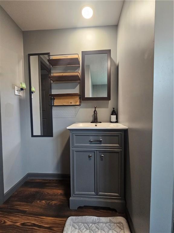 57 Interstate Pkwy, Bradford-City, PA 16701 - bathroom with wood finished floors, baseboards, and vanity
