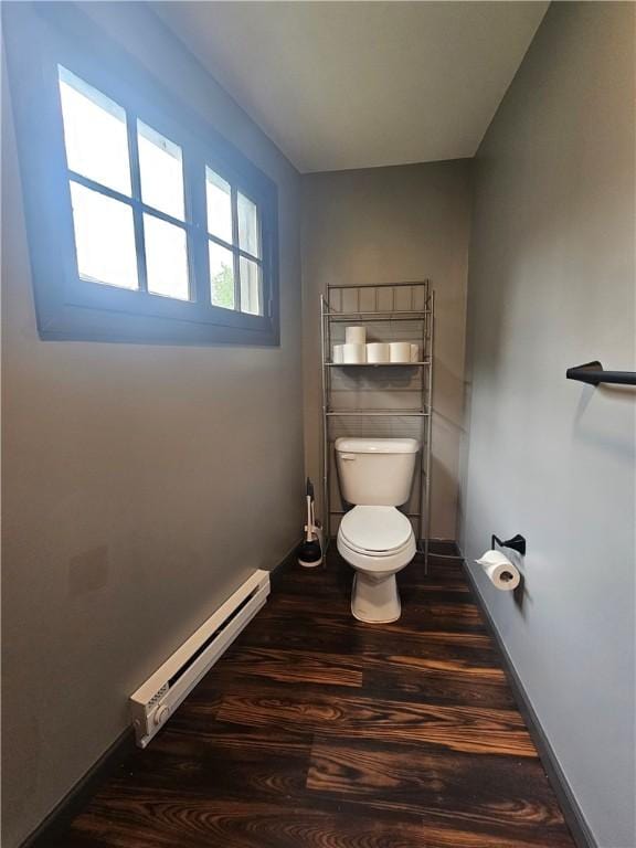 57 Interstate Pkwy, Bradford-City, PA 16701 - bathroom featuring a baseboard heating unit, toilet, wood finished floors, and baseboards