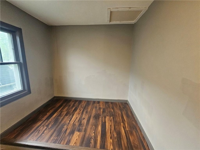 57 Interstate Pkwy, Bradford-City, PA 16701 - empty room with baseboards, attic access, and dark wood-style flooring