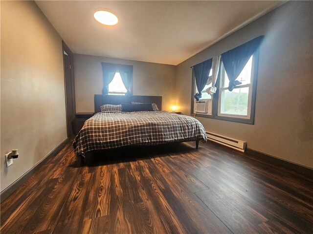 57 Interstate Pkwy, Bradford-City, PA 16701 - bedroom featuring a baseboard radiator, dark wood-type flooring, cooling unit, and baseboards