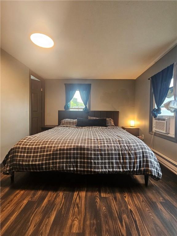 57 Interstate Pkwy, Bradford-City, PA 16701 - bedroom featuring cooling unit, wood finished floors, and a baseboard radiator