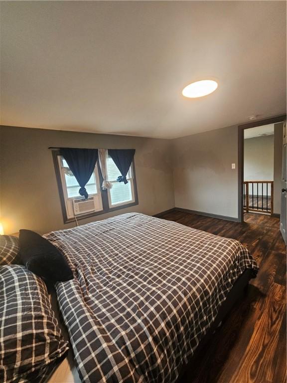 57 Interstate Pkwy, Bradford-City, PA 16701 - bedroom with dark wood-style flooring, baseboards, and cooling unit