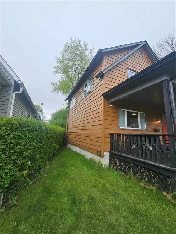 57 Interstate Pkwy, Bradford-City, PA 16701 - view of property exterior with a lawn and covered porch