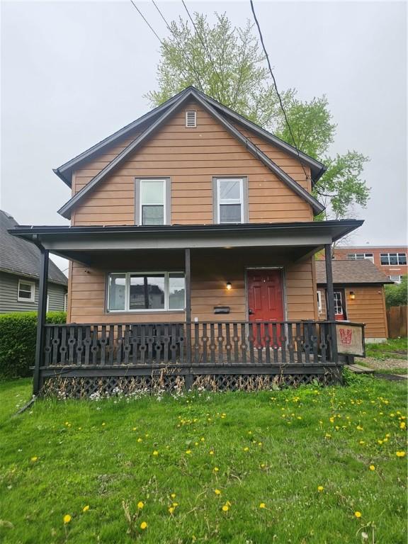 57 Interstate Pkwy, Bradford-City, PA 16701 - back of property featuring a porch and a lawn