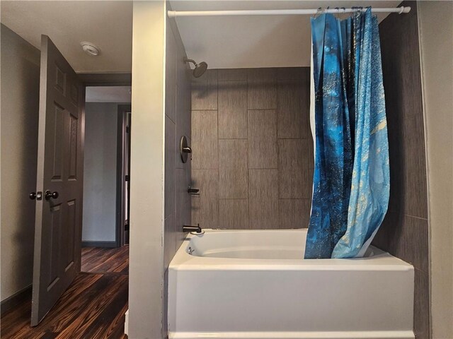 57 Interstate Pkwy, Bradford-City, PA 16701 - full bathroom featuring shower / bath combo, wood finished floors, and baseboards