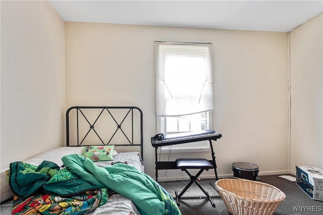 bedroom with carpet and multiple windows