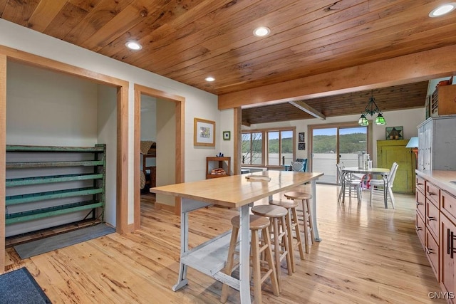 dining room featuring wood ceiling, light wood finished floors, and recessed lighting