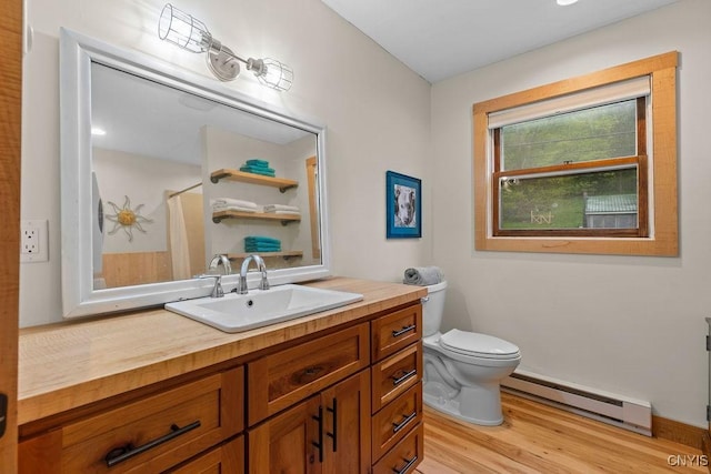 bathroom featuring a baseboard heating unit, wood finished floors, toilet, vanity, and a shower with shower curtain