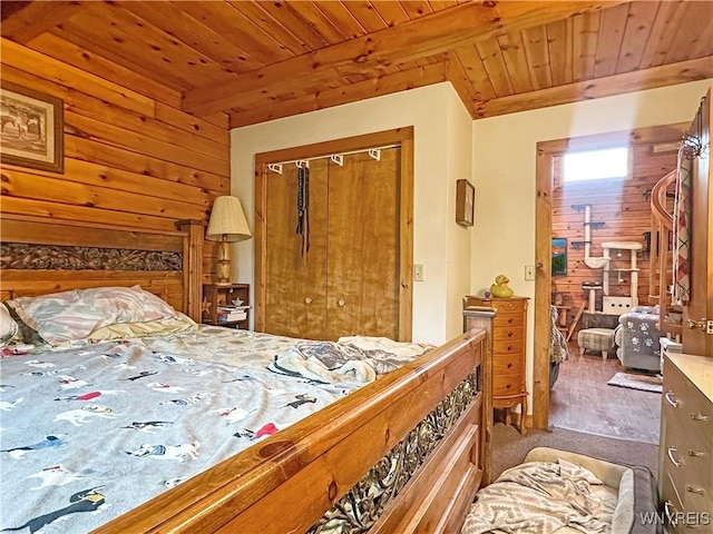 2669 Town Line Rd, Mount Morris, NY 14517 - bedroom featuring wooden ceiling, a closet, wood walls, and carpet