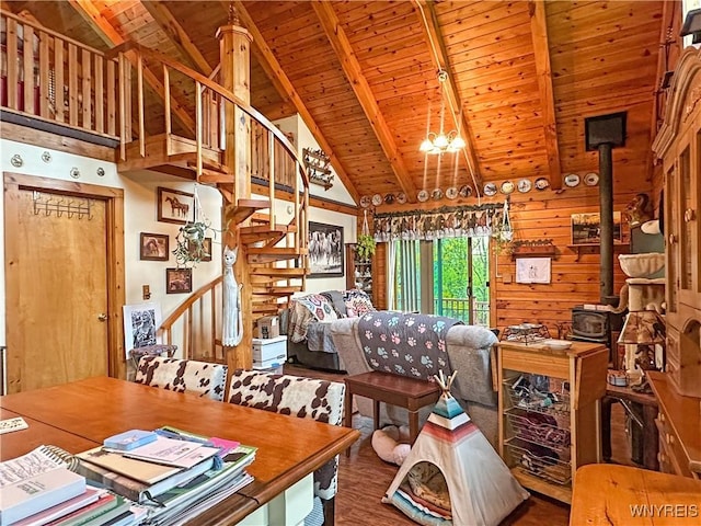 2669 Town Line Rd, Mount Morris, NY 14517 - living room with wood ceiling with exposed beams, a wood stove, high vaulted ceiling, wood finished floors, and stairs