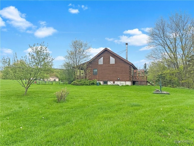 2669 Town Line Rd, Mount Morris, NY 14517 - view of property exterior featuring a yard, log siding, and a deck