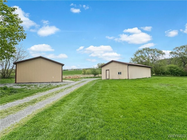 2669 Town Line Rd, Mount Morris, NY 14517 - view of green lawn featuring an outbuilding and driveway