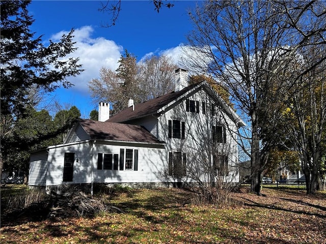 93 Main St, Laurens, NY 13796 - view of side of home with a chimney