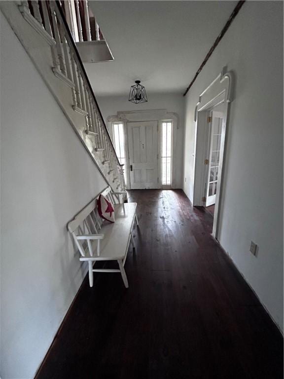 93 Main St, Laurens, NY 13796 - foyer entrance with dark wood-style floors and stairway