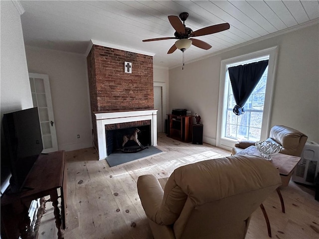 93 Main St, Laurens, NY 13796 - living area with ornamental molding, a ceiling fan, a fireplace, light wood-type flooring, and wooden ceiling