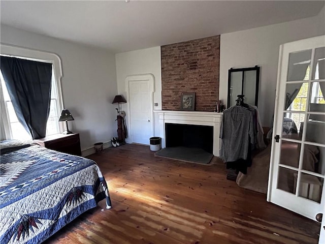 93 Main St, Laurens, NY 13796 - bedroom featuring wood finished floors, a fireplace, and baseboards