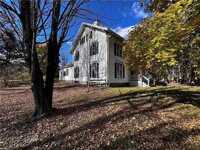 93 Main St, Laurens, NY 13796 - view of home's exterior featuring a chimney