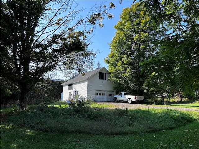 93 Main St, Laurens, NY 13796 - view of side of home with an attached garage