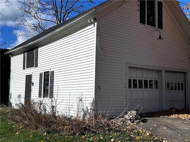 93 Main St, Laurens, NY 13796 - view of side of property featuring an attached garage
