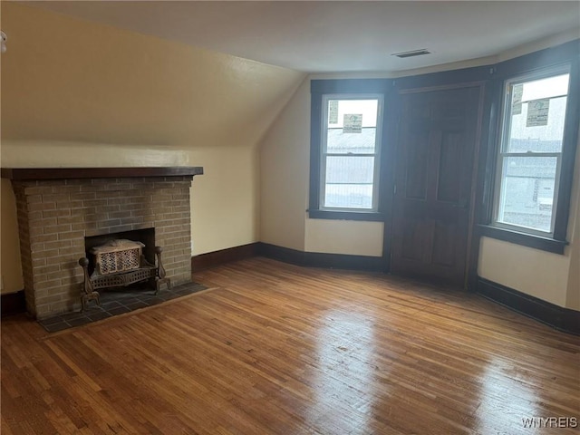 231 Grider St, Buffalo, NY 14215 - bonus room with hardwood / wood-style floors, lofted ceiling, and baseboards