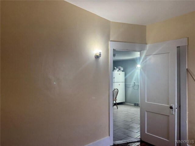 231 Grider St, Buffalo, NY 14215 - hall with baseboards and tile patterned floors