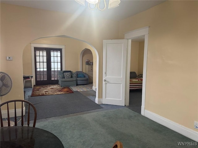231 Grider St, Buffalo, NY 14215 - entryway with arched walkways, french doors, carpet floors, and baseboards