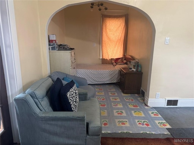 231 Grider St, Buffalo, NY 14215 - living room featuring arched walkways and carpet floors
