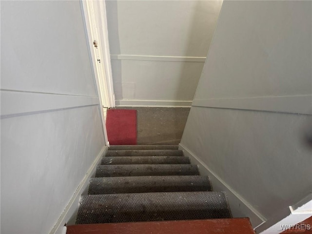 231 Grider St, Buffalo, NY 14215 - staircase with baseboards and carpet flooring