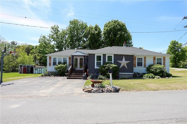 285 Clinton St, Gouverneur, NY 13642 - view of front of property with french doors and a front lawn