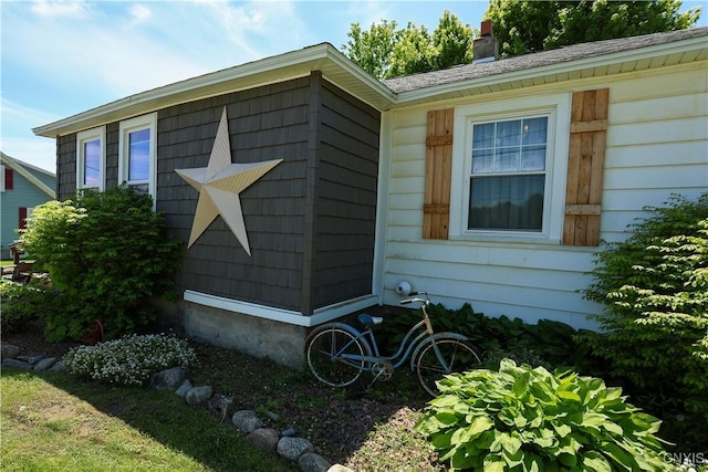 285 Clinton St, Gouverneur, NY 13642 - view of side of property with a chimney