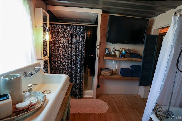 285 Clinton St, Gouverneur, NY 13642 - bathroom featuring curtained shower, wood finished floors, and vanity
