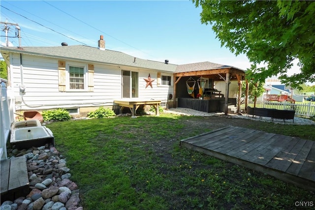 285 Clinton St, Gouverneur, NY 13642 - rear view of house with a wooden deck and a chimney