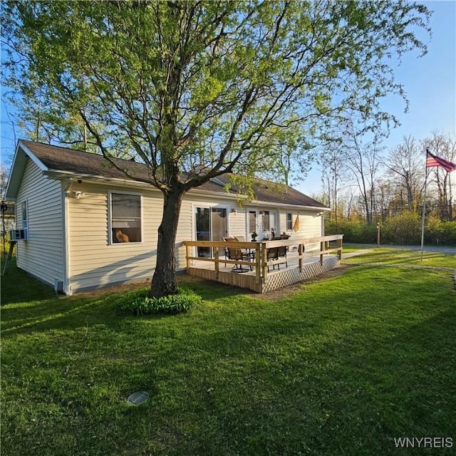 back of house with a yard, a deck, and cooling unit