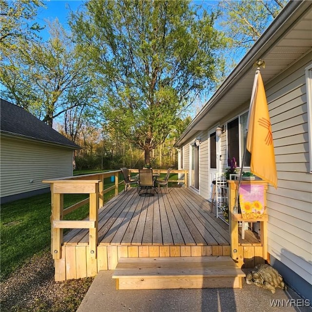 deck featuring outdoor dining area