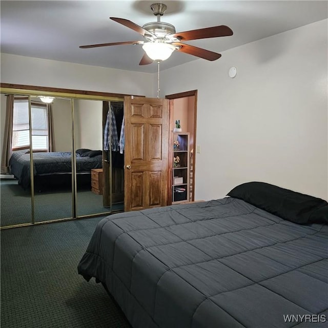 carpeted bedroom with a closet and a ceiling fan