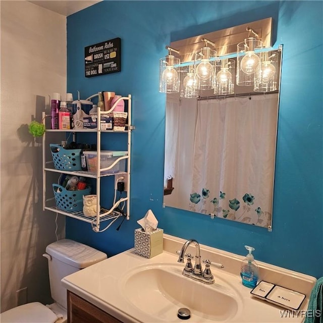 bathroom with vanity and toilet