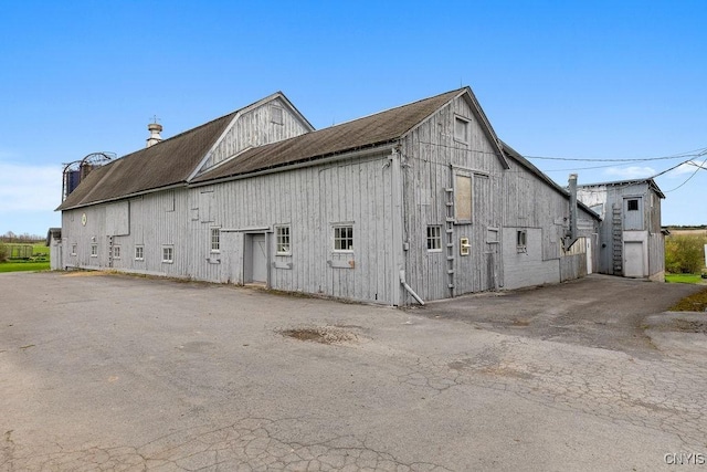2066 Deerlick Rd, Cape Vincent, NY 13618 - rear view of property with a barn and an outdoor structure
