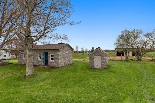 2066 Deerlick Rd, Cape Vincent, NY 13618 - view of green lawn with an outbuilding and a shed