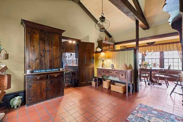 2066 Deerlick Rd, Cape Vincent, NY 13618 - kitchen with dark tile patterned floors, a chandelier, and dark brown cabinets