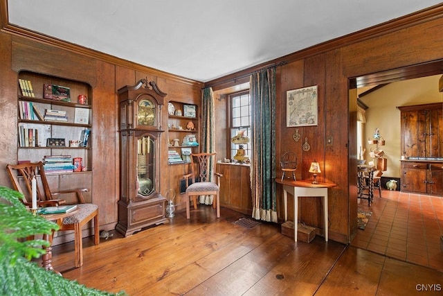 2066 Deerlick Rd, Cape Vincent, NY 13618 - living area featuring crown molding, wooden walls, and wood-type flooring