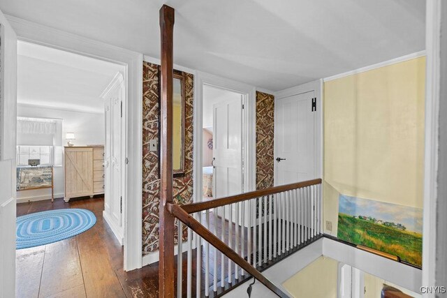2066 Deerlick Rd, Cape Vincent, NY 13618 - hallway with an upstairs landing, dark wood-style flooring, and baseboards