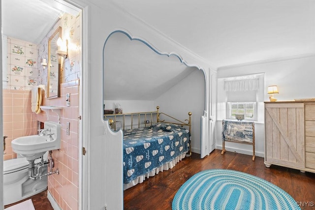 2066 Deerlick Rd, Cape Vincent, NY 13618 - bedroom featuring wood finished floors, crown molding, a sink, and tile walls