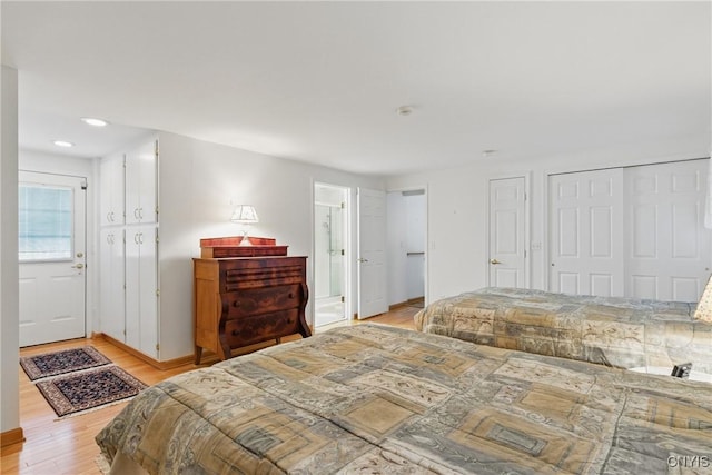 106 Lee Ter, Manlius, NY 13057 - bedroom featuring light wood-style floors, multiple closets, recessed lighting, ensuite bath, and baseboards