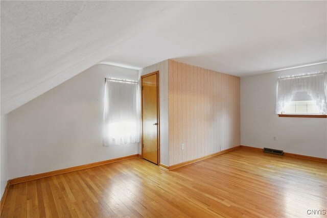 106 Lee Ter, Manlius, NY 13057 - bonus room with light wood-type flooring, lofted ceiling, and baseboards