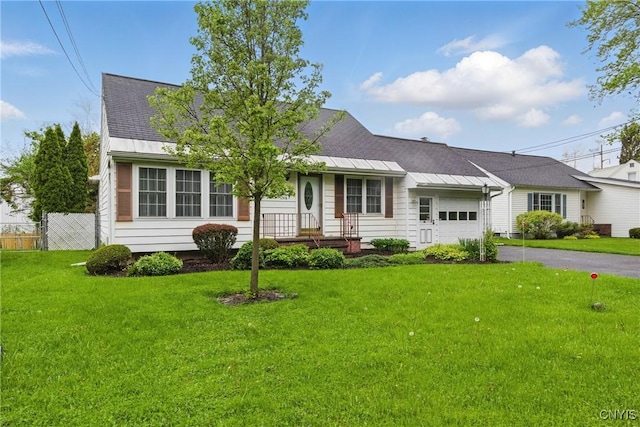 106 Lee Ter, Manlius, NY 13057 - view of front of house featuring an attached garage, asphalt driveway, and a shingled roof