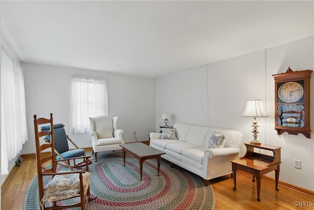 106 Lee Ter, Manlius, NY 13057 - living area featuring light wood-style floors and baseboards